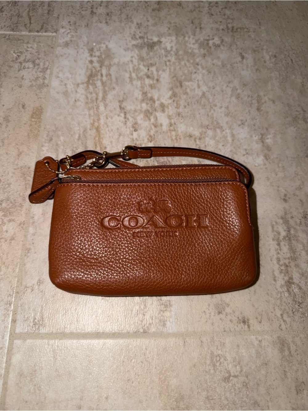 Coach Pebbled Leather Wristlet in Cognac Brown